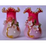 A PAIR OF VICTORIAN PINK GLASS OVERLAID VASES BY STEVENS & WILLIAMS, decorated with flowering vines.