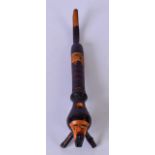 A CHERRY WOOD PIPE, the bowl carved in the form of an arab head. 24 cm long.