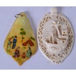 AN EARLY 20TH CENTURY EUROPEAN CARVED IVORY PLAQUE OR PENDANT, decorated with a ship, together