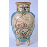 A LARGE JAPANESE SATSUMA TRI LEGGED POTTERY VASE , hand painted with birds amongst foliage and