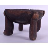 AN EARLY 20TH CENTURY AFRICAN TRIBAL CARVED WOOD STOOL possibly Tanzanian, with dish shaped top.