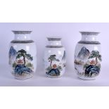 A PAIR OF CHINESE REPUBLICAN PERIOD LANDSCAPE VASES together with a matching smaller vase painted