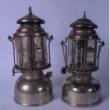 A PAIR OF EARLY 20TH CENTURY LAMPS, swing handled. 39 cm.