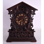 AN EARLY 20TH CENTURY GERMAN BAVARIAN BLACK FOREST CUCKOO CLOCK overlaid with vines and leaves. 39