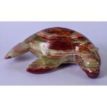 A LARGE CARVED ONYX STATUE CARVED IN THE FORM OF A SEAL, modelled laying down. 22 cm wide,