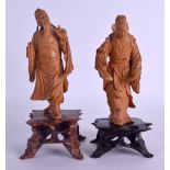 A PAIR OF EARLY 20TH CENTURY CHINESE CARVED BOXWOOD FIGURES modelled upon openwork bases. 22 cm