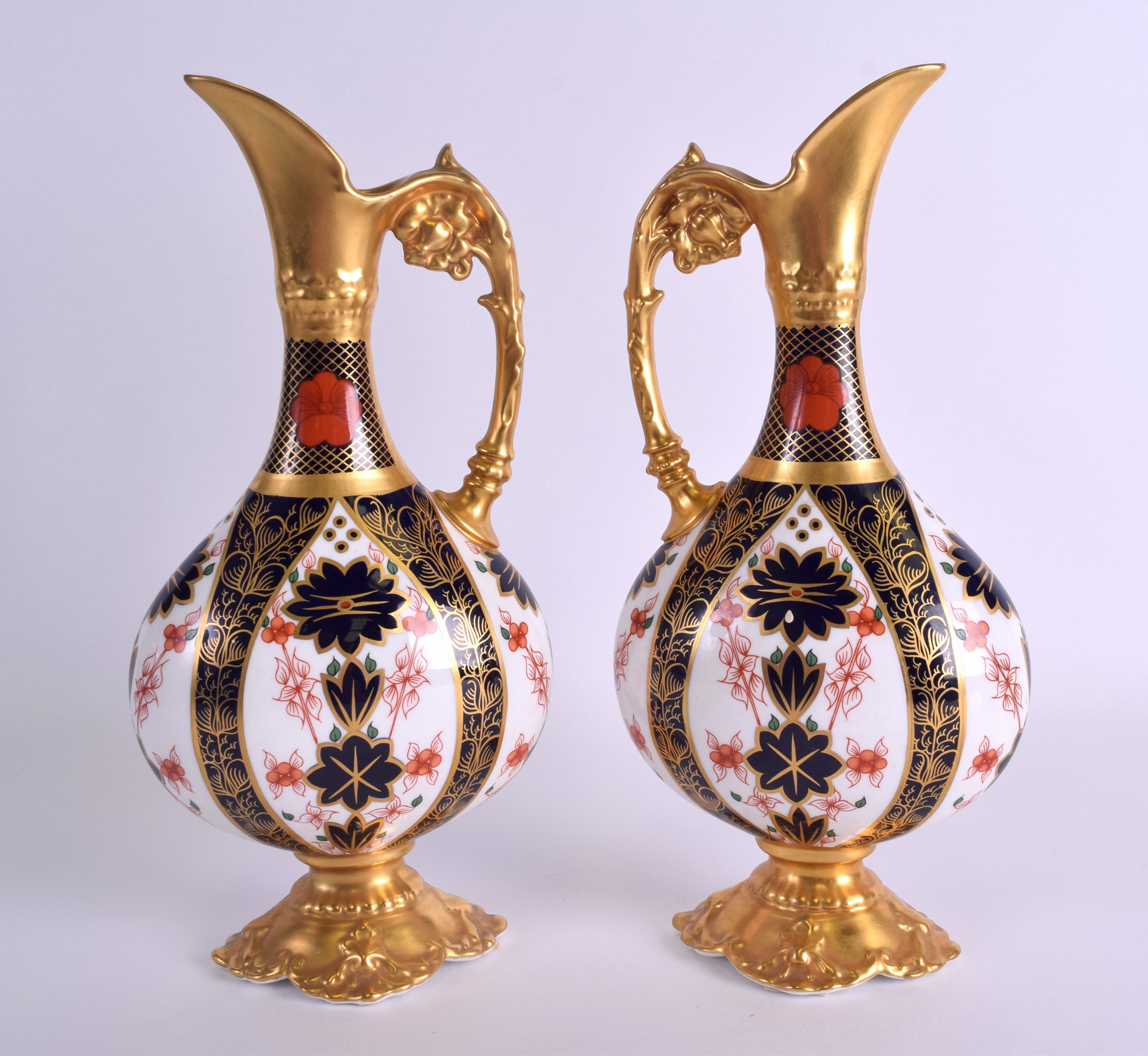 A PAIR OF ROYAL CROWN DERBY IMARI JUGS Pattern 1128. 27 cm high.