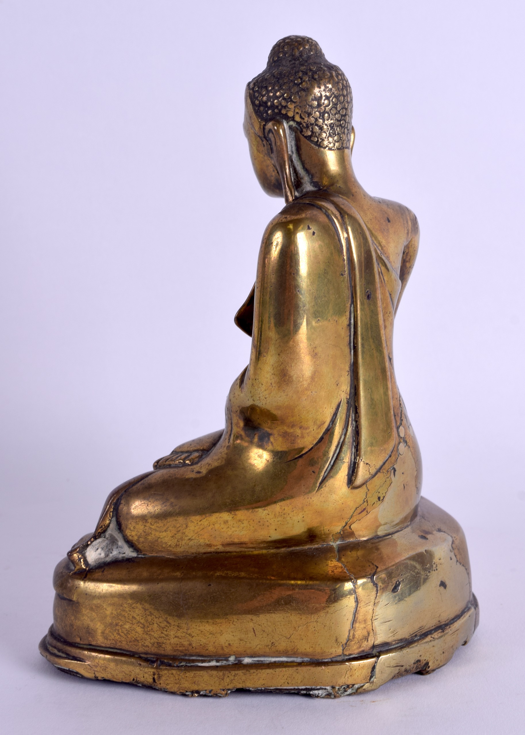 A 17TH CENTURY TIBETAN CHINESE ASIAN BRONZE FIGURE OF A BUDDHA modelled in robes upon a triangular - Image 2 of 4