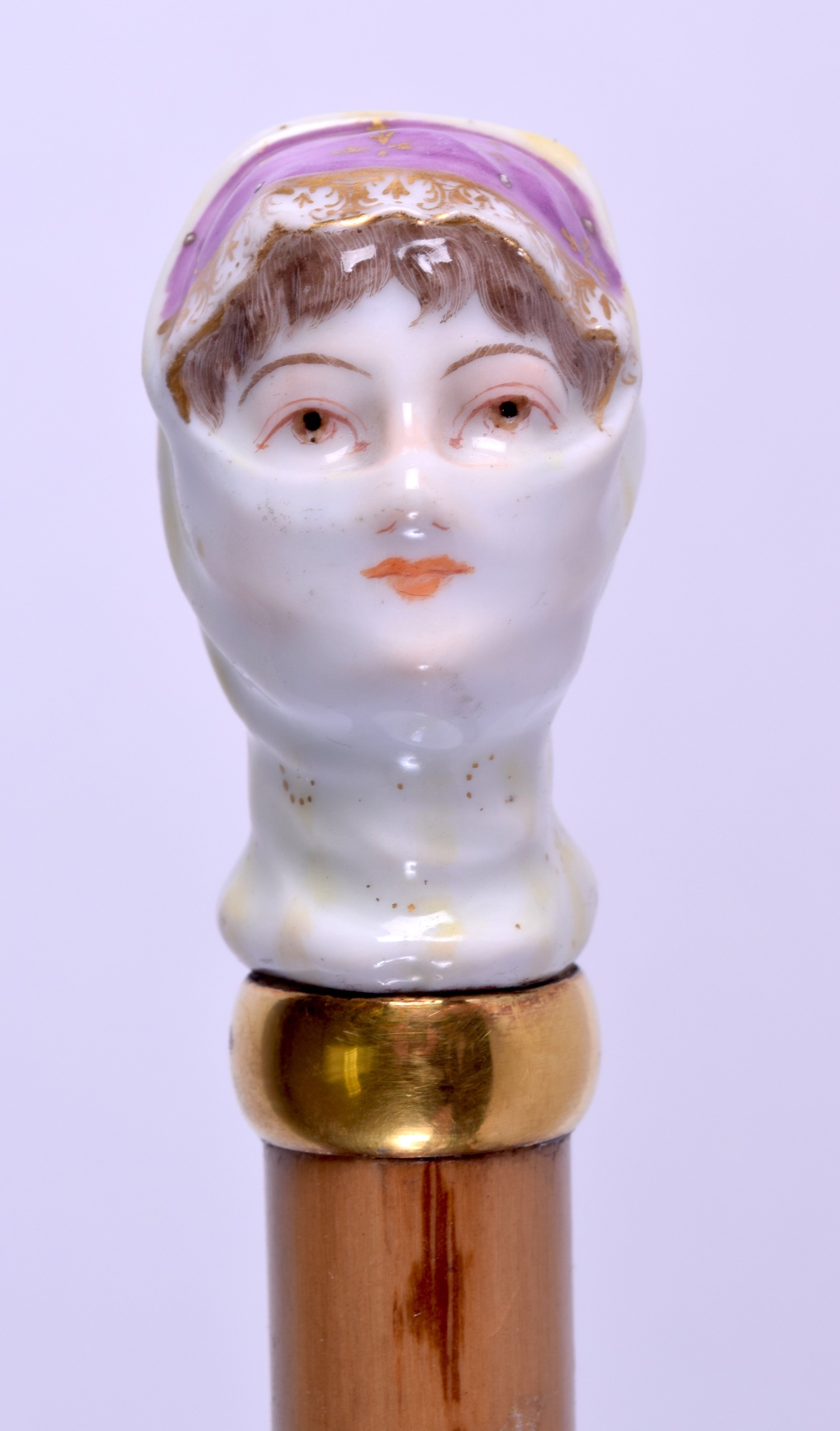 AN UNUSUAL 19TH CENTURY CONTINENTAL PORCELAIN 'MASKED FEMALE' PARASOL unusually formed as a gypsy