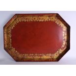 A LARGE REGENCY PAINTED AND LACQUERED OCTAGONAL TRAY highlighted in gilt with foliage and motifs. 77