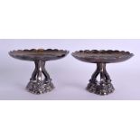 A RARE PAIR OF 19TH CENTURY CHINESE EXPORT SILVER PEDESTAL TAZZA decorated with foliage under a