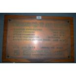 A KAWAZAKI STEAM BOILER PLAQUE, set on an oak panel. 36.5 cm x 57 cm.