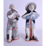A PAIR OF EARLY 20TH CENTURY CHINESE FAMILLE ROSE PORCELAIN FIGURES Guangxu, each upon coral painted