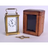 AN EARLY 20TH CENTURY FRENCH BRASS CARRIAGE CLOCK with white enamel dial and black numerals. 14 cm