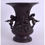 A 19TH CENTURY JAPANESE MEIJI PERIOD TWIN HANDLED BRONZE VASE decorated with foliage. 14 cm high.