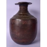 A LARGE 19TH CENTURY EASTERN COPPER VESSEL, with engraved banding to body. 34 cm high.