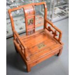 AN EARLY 20TH CENTURY CHINESE SOFTWOOD CHAIR, with carved lacquered panels and storage area under