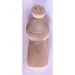 AN EARLY CENTRAL ASIAN CARVED STONE IDOL modelled as a standing figure. 7.5 cm high.