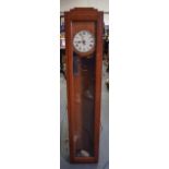 AN EARLY 20TH CENTURY OAK WALL CLOCK. By "Telephone Rentals". 131 cm long.