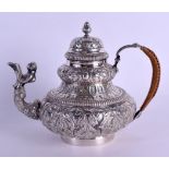AN 18TH/19TH CENTURY DUTCH SILVER TEAPOT AND COVER with figural spout, decorated in relief with