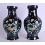 A PAIR OF 19TH CENTURY CHINESE FAMILLE NOIRE PORCELAIN VASES bearing Kangxi marks to base, painted