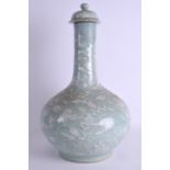 A LARGE 18TH/19TH CENTURY CHINESE CELADON BOTTLE VASE AND COVER Qianlong/Jiaqing, moulded with white