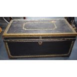 AN EARLY 20TH CENTURY LEATHER CHEST OR TRUNK, with applied brass studwork decoration. 42 cm x 90