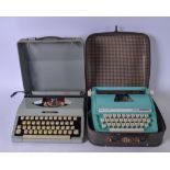 A CASED VINTAGE PETITE TURQOUISE JUNIOR DE LUXE TYPEWRITER, together with a vintage "Imperial"