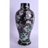 A 19TH CENTURY CHINESE FAMILLE NOIRE PORCELAIN VASE painted with a bird upon hollow rock. 28 cm