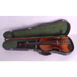 A CASED SINGLE PIECE BACK VIOLIN with bow, bearing stamp to reverse. 59 cm long. (2)