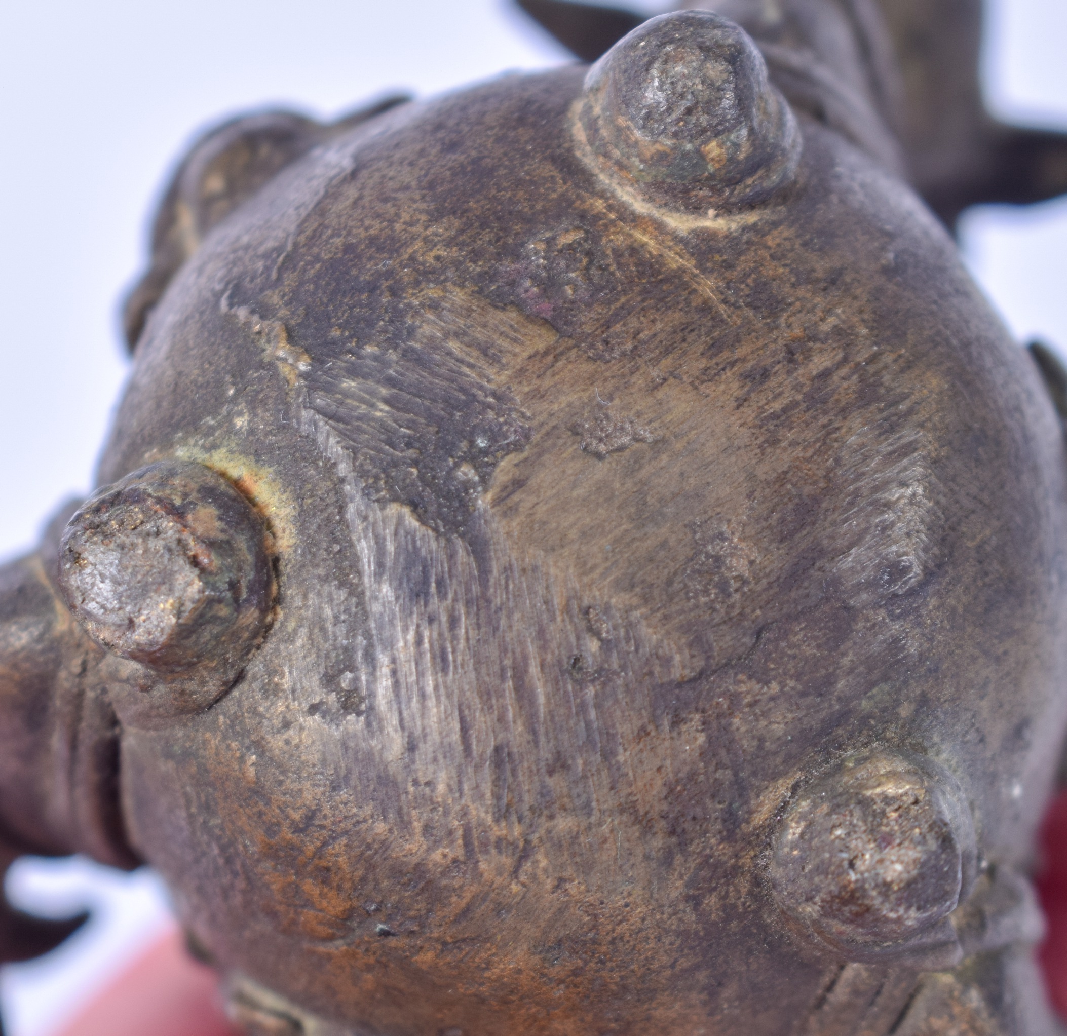 AN 18TH/19TH CENTURY INDIAN BRONZE CENSER, formed with three mask head handles. 9 cm high. - Image 3 of 3