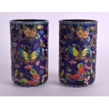 A PAIR OF EARLY 20TH CENTURY CONTINENTAL CHAMPLEVE ENAMEL VASES possibly Russian, decorated with