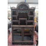 A FINE LARGE 19TH CENTURY CHINESE CARVED HONGMU DISPLAY CABINET Qing, of unusually deep form, well