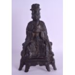 A GOOD 16TH/17TH CENTURY CHINESE BRONZE FIGURE OF A SEATED DEITY modelled holding a vessel, engraved