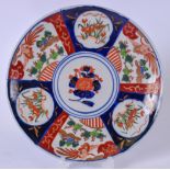 A JAPANESE MEIJI PERIOD IMARI PORCELAIN DISH, decorated with panels of mythical birds and foliage,