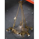 A CONTINENTAL CHANDELIER WITH CUT GLASS CRYSTAL DOME AND COVER, gilt metal suspension and three