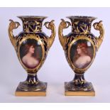 A FINE PAIR OF MID 19TH CENTURY TWIN HANDLED BERLIN VASES painted with female portraits under a