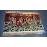 AN UNSUAL CHINESE RUG, decorated with the eight immortals upon a vessel in crashing waves. 78 cm x