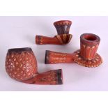 A SET OF THREE MIDDLE EASTERN TURKISH CLAY PIPES gold inlaid with various motifs. Largest 10 cm