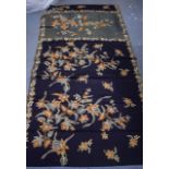 A 20TH CENTURY SOUTHEAST ASIAN BLACK AND GOLD SARONG, decorated with foliage. 180 cm x 100 cm.