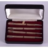 A SET OF ART DECO SILVER AND ENAMEL BRIDGE PENS. (4)