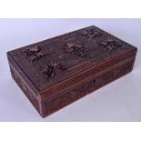 AN EARLY 20TH CENTURY WOODEN BOX, carved with extensive foliage. 30.5 cm wide.