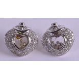 A PAIR OF 18CT WHITE GOLD AND DIAMOND HEART SHAPED EARRINGS Attributed to Chopard. 22.3 grams. 2.5