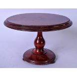 AN EARLY 20TH CENTURY MAHOGANY APPRENTICE BREAKFAST TILT TOP TABLE, carved in a stepped pedestal