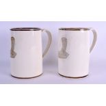 A RARE PAIR OF EARLY 19TH CENTURY WEDGWOOD CREAMWARE MUGS decorated with cornucopia. 16 cm high.
