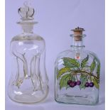 A STYLISH HOLMEGARD KLUK KLUK GLASS DECANTER AND STOPPER, together with another similar. Largest
