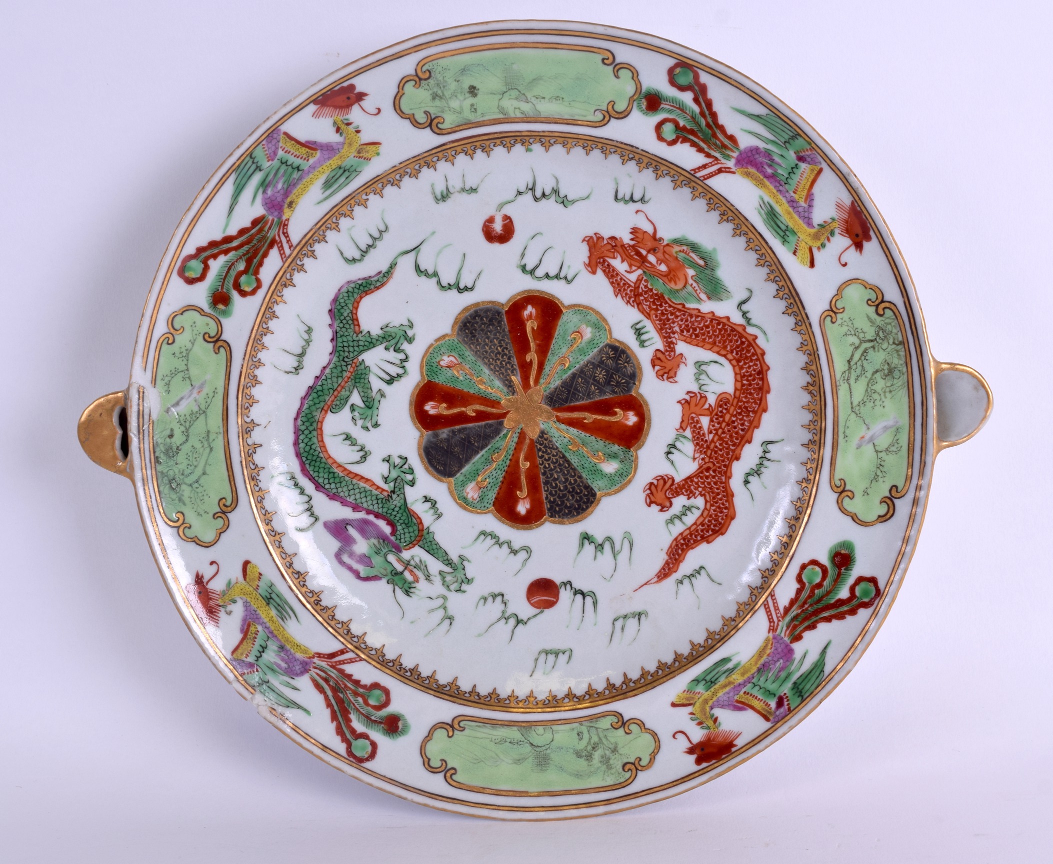 A RARE EARLY 19TH CENTURY CHINESE FAMILLE ROSE HOT WARMING PLATE Jiaqing, painted with dragons and