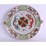 A RARE EARLY 19TH CENTURY CHINESE FAMILLE ROSE HOT WARMING PLATE Jiaqing, painted with dragons and