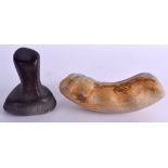 AN EARLY STONE AGE PESTLE together with an unusual hand held white stone tool. Pestle 10 cm high,