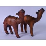 A PAIR OF MID 20TH CENTURY LEATHER CAMELS, modelled standing. 32 cm x 39 cm.